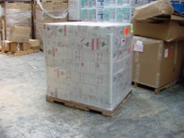 click image to view shrink-wrapped shipping pallet for commercial cargo